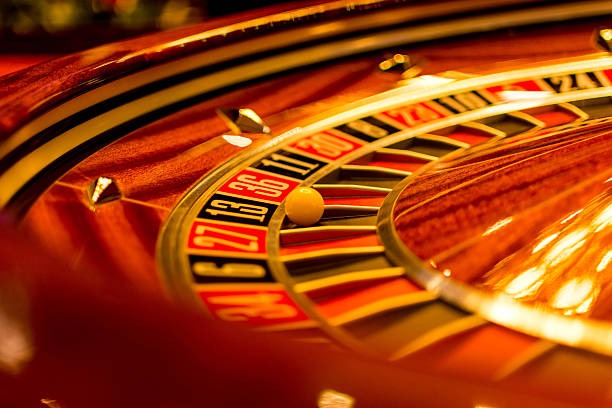 Live dealer blackjack table streamed on surga11 login app with Jurassic Kingdom slot interface visible